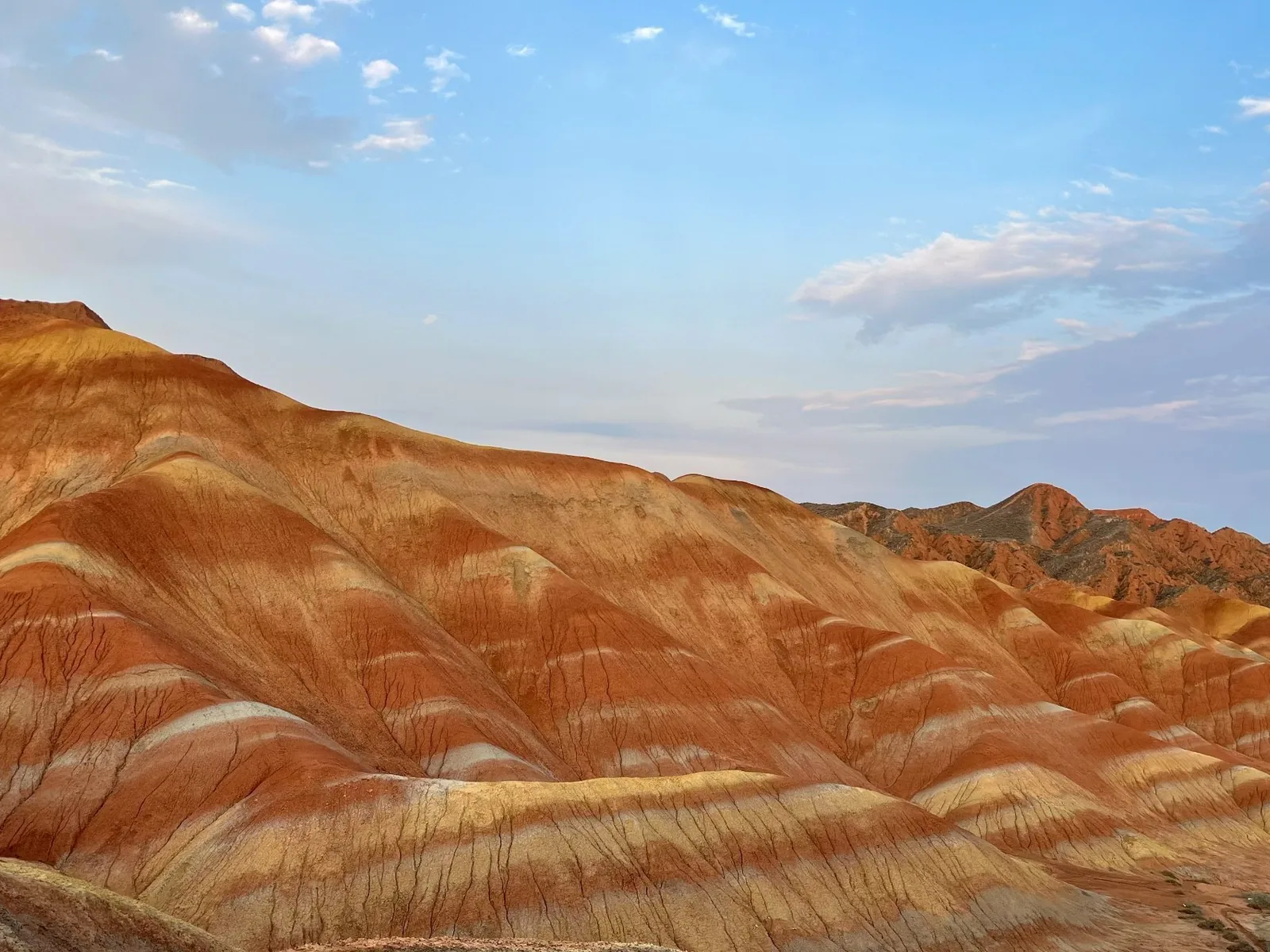 The colourful Danxia landforms beneath a blue sky